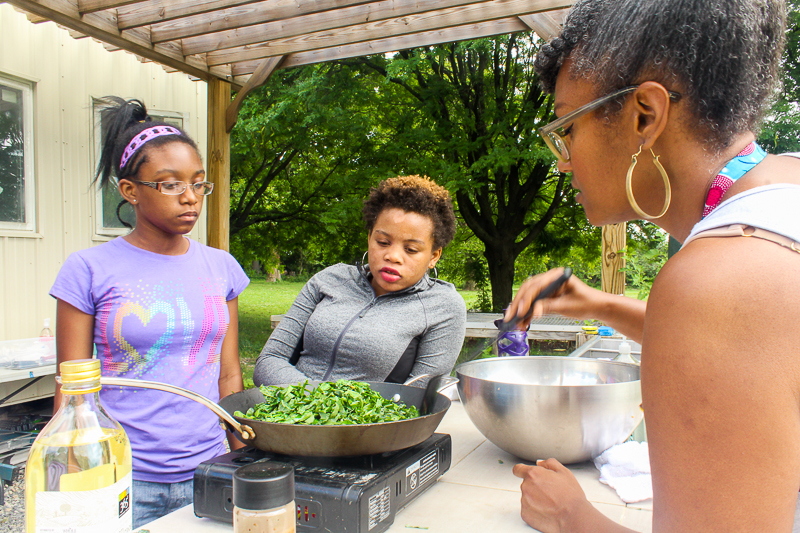 Seasoning and sautéing collards, Our Mothers' Kitchens Camp, 2017. Photo: Gabrielle Clark.