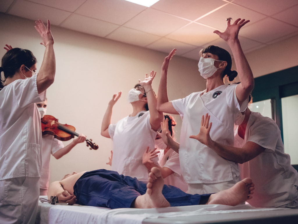 First, Do No Harm Opening Surgery Dance: Performers Cortney McGuire, Julie Rooney, Kate Speer, Tara Rynders, Rowan Salem, and Maegan Keller explore the nurses ability to grow additional arms in order to complete the many tasks needed in patient care. Photo by DW Burnett.